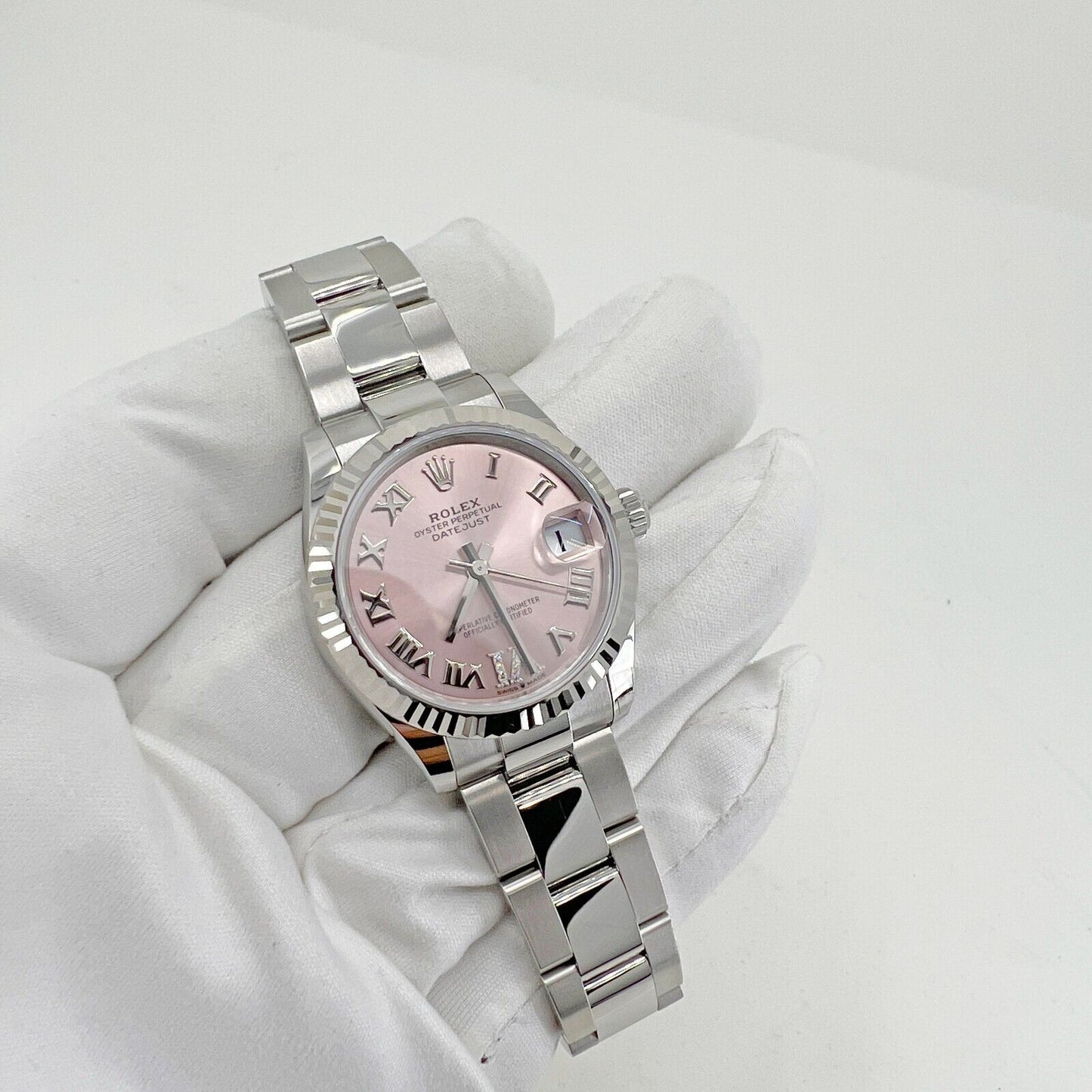 Rolex Datejust 31, Oystersteel and 18k White Gold with Diamonds, Pink Roman dial, 31mm, Fluted, Oyster, Ref# 278274-0023, Main view